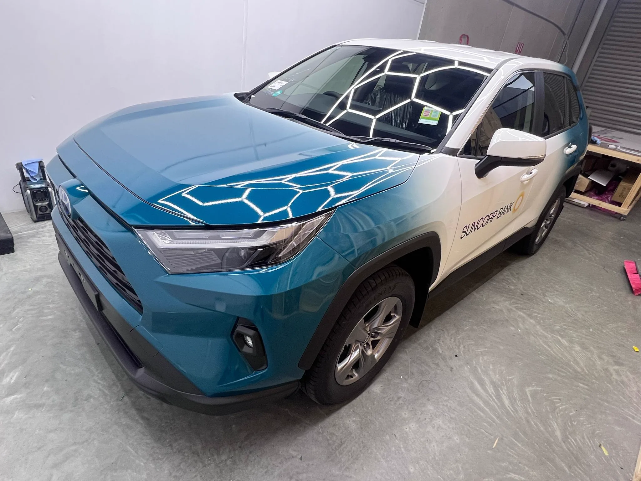 Blue colour-change wrap applied to an SUV