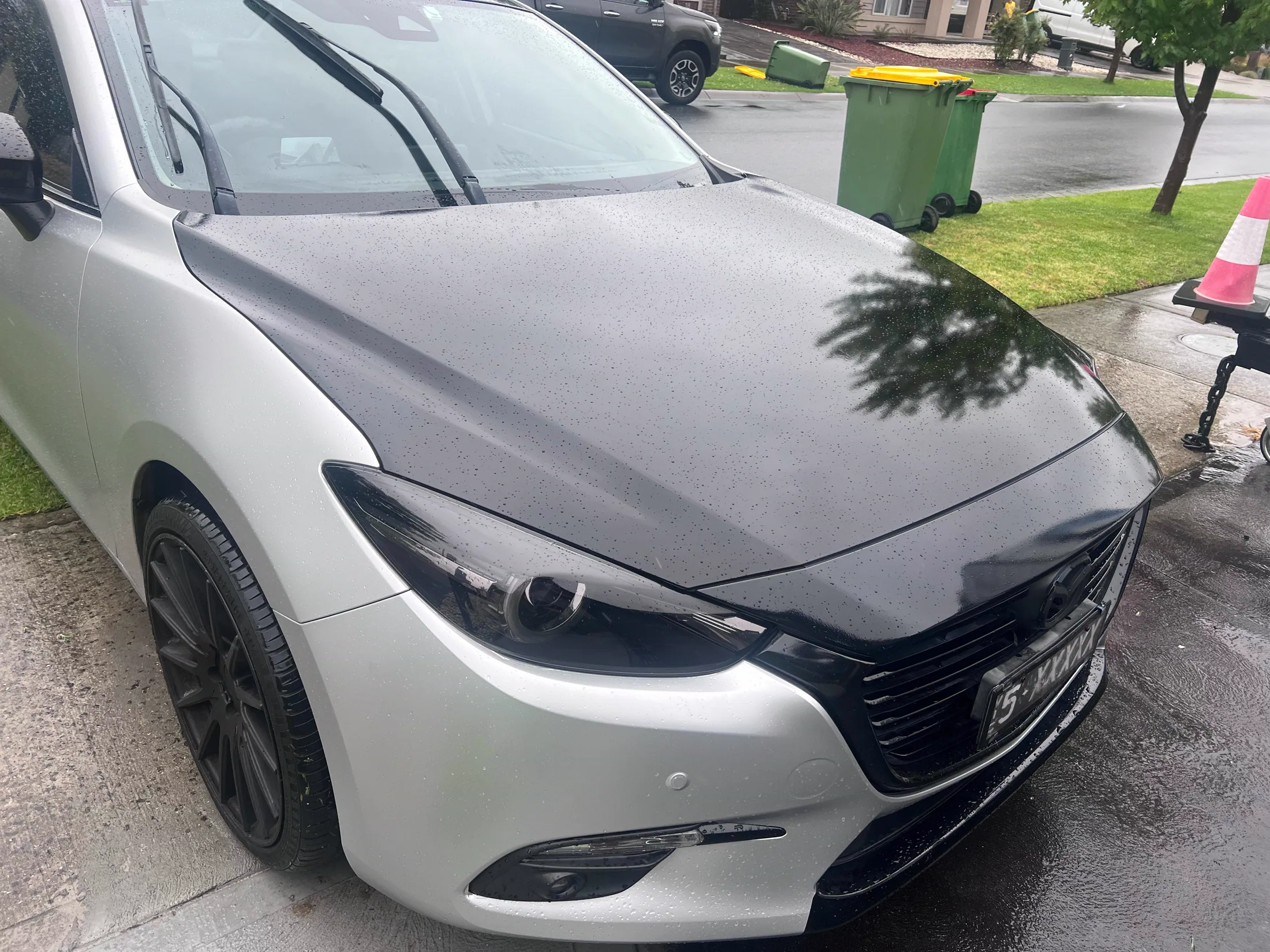 Contrasting bonnet wrap on a white car